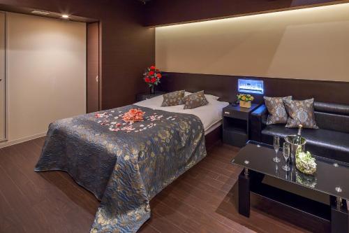Katil atau katil-katil dalam bilik di Hotel PLAISIR (Adult Only)