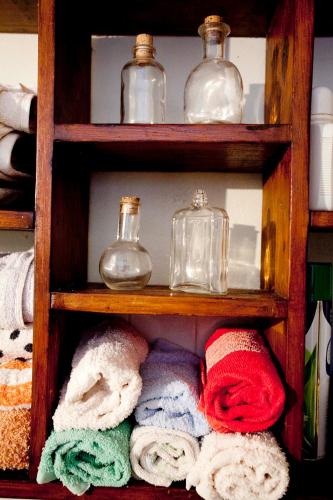 a shelf with towels and other items on it at Casa Corradini in Sarteano