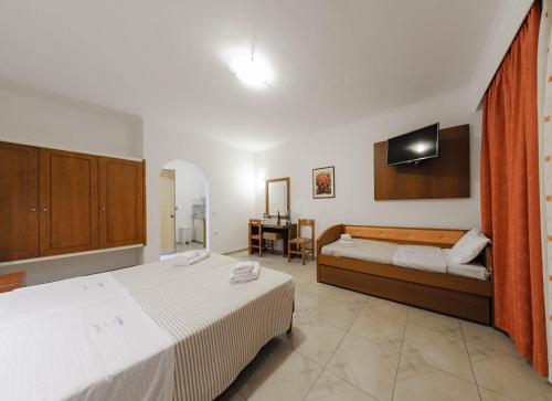 Ένα ή περισσότερα κρεβάτια σε δωμάτιο στο Zante Palace 