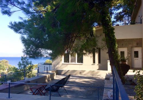 a house with a view of the ocean at Armonia Villas in Skala Rachoniou