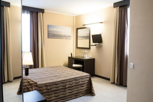 Postel nebo postele na pokoji v ubytování Hotel Corte Business