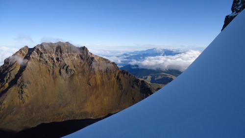 a view of a mountain from the wing of an airplane at Hostería Chíguac in Machachi
