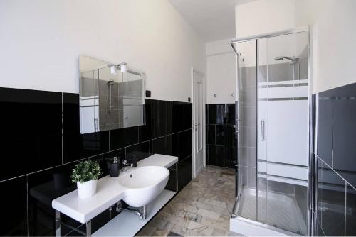 a bathroom with a sink and a shower at MC Guest House in Rome