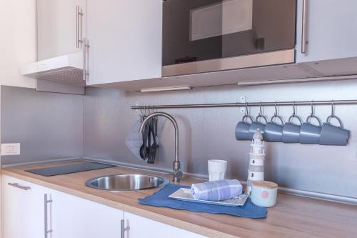 Η κουζίνα ή μικρή κουζίνα στο Alessia's Flat - Affori
