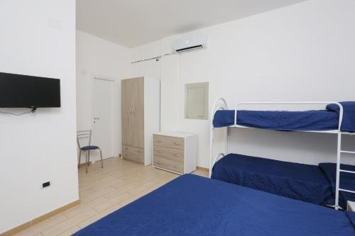 Postel nebo postele na pokoji v ubytování Camping Lido di Salerno