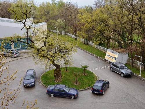 a group of cars parked in a parking lot at Augusta SPA Hotel in Hisarya