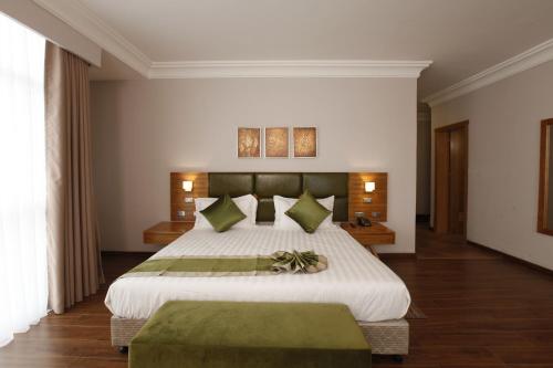 Ένα ή περισσότερα κρεβάτια σε δωμάτιο στο Sabon Hotel