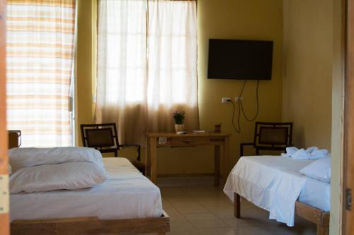 Postel nebo postele na pokoji v ubytování Hotel Valerie