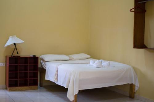 Postel nebo postele na pokoji v ubytování Hotel Valerie