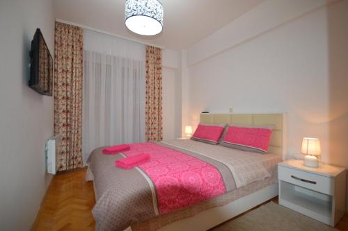 Ένα ή περισσότερα κρεβάτια σε δωμάτιο στο Ristevski Apartments
