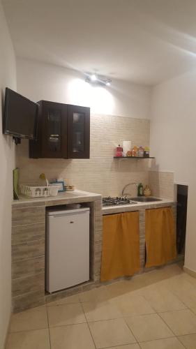 Kuchyňa alebo kuchynka v ubytovaní Room Calafatari