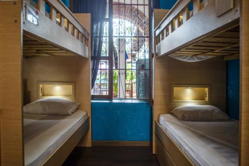 Villana's Hostal Santa Martaにあるベッド