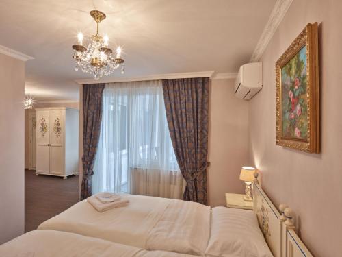 Postel nebo postele na pokoji v ubytování Apartment-Hotel am Rathaus