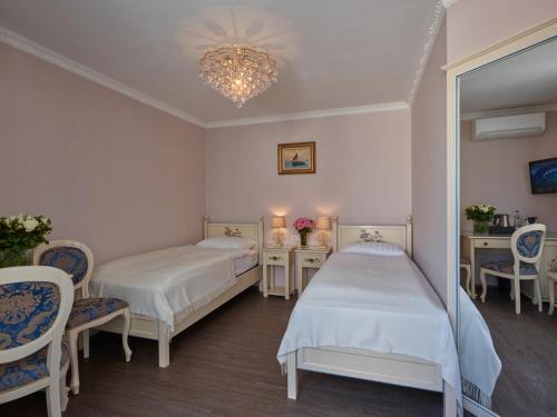 Postel nebo postele na pokoji v ubytování Apartment-Hotel am Rathaus