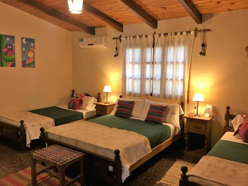 Un pat sau paturi într-o cameră la La Posada De Juan