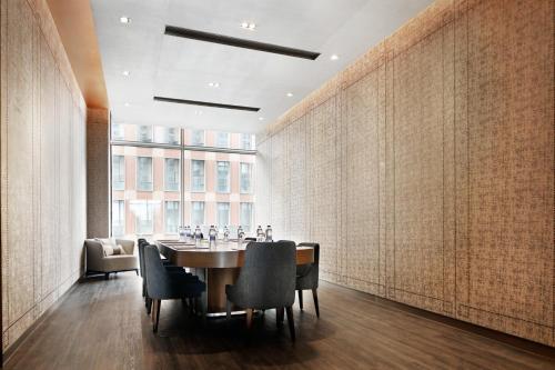 a dining room with a table and chairs at Artyzen Habitat Dongzhimen Beijing in Beijing