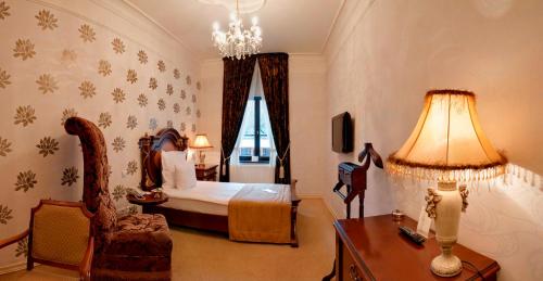 Postel nebo postele na pokoji v ubytování Bohema Boutique Hotel & Spa