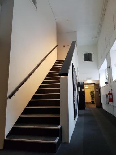 a staircase in a building with a stair case at Hotell Centralstation in Uppsala