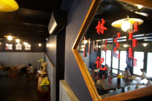 a restaurant with a counter with christmas decorations on it at Tian Jing Hotel in Kuala Lumpur