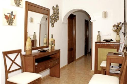 a room with a mirror and a dresser with a mirror at Hostal Las Torres in Madrid