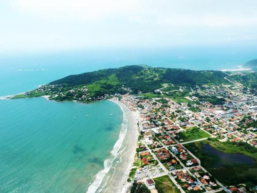 an aerial view of a beach and the ocean at Solar de Garopaba in Garopaba