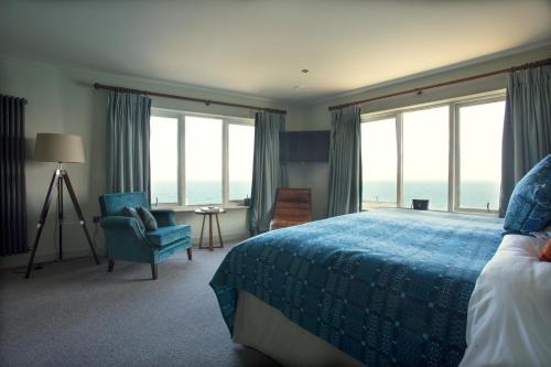 Ένα ή περισσότερα κρεβάτια σε δωμάτιο στο The Lewinnick Lodge