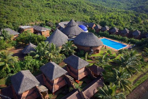 an aerial view of a resort with a swimming pool at SwaSwara Gokarna - a CGH Earth Experience in Gokarna