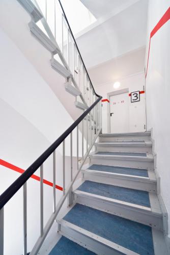 a stairwell in a building with a number on it at Old Town Hostel in Berlin