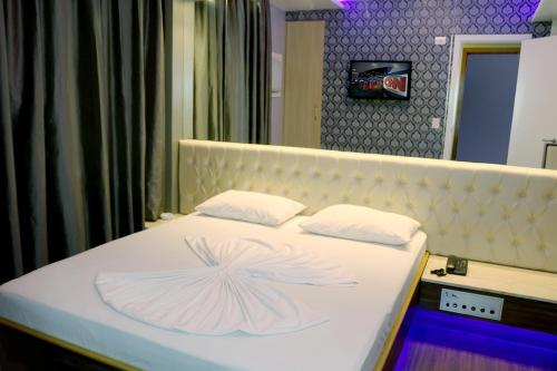 Katil atau katil-katil dalam bilik di Hotel Praia Grande Niterói