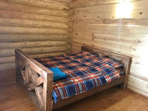 מיטה או מיטות בחדר ב-Cottage Radomyshl'