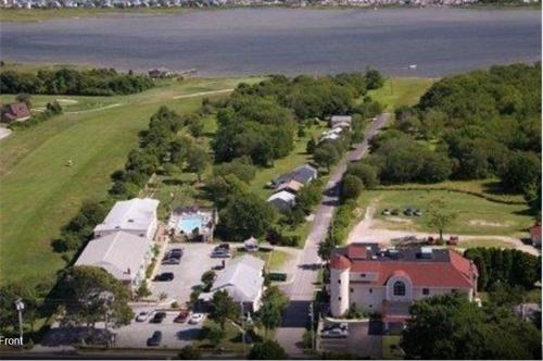an aerial view of a house with a parking lot at Winnapaug Inn in Westerly