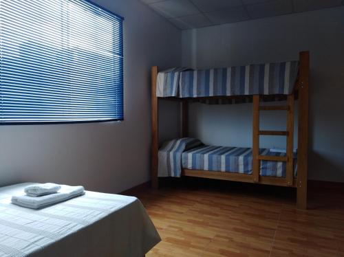 Cama o camas de una habitación en Punta Huanchaco Hostel