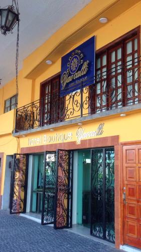 a hotel building with a sign on top of it at Hotel Yaocalli in San Martín de las Pirámides