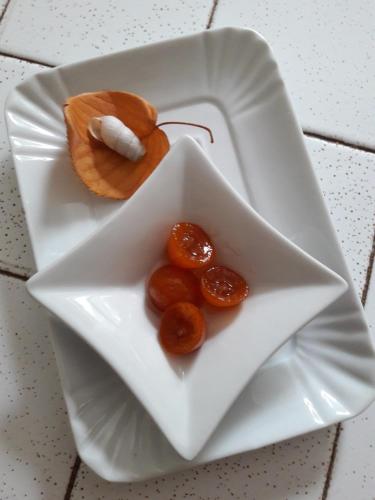 a white plate with some food on it at B&B Villa Ada in Formia