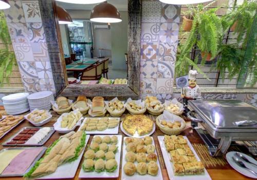 a buffet with many different types of food on display at Ecos Conforto in Porto Velho