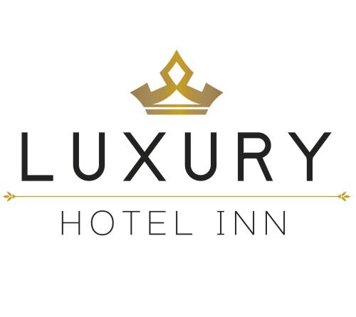 a black luxury hotel inn sign with a crown at Luxury Hotel Inn in Peñita de Jaltemba