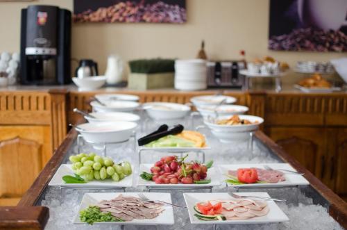 a buffet with different types of food on a table at Gooderson Kloppenheim Country Estate in Machadodorp