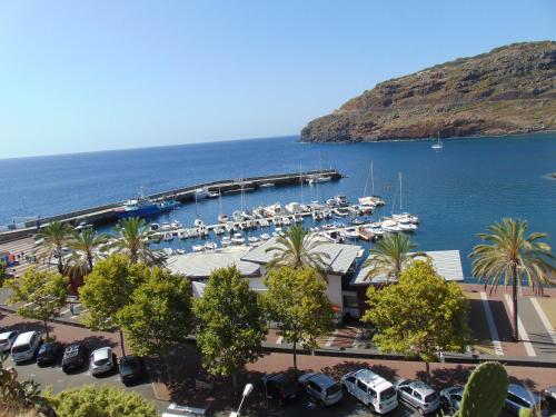a marina with a bunch of boats in the water at Marques House in Machico