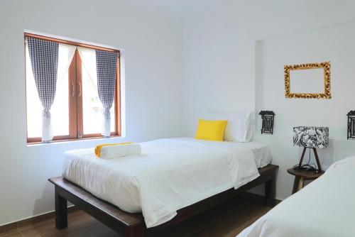Postel nebo postele na pokoji v ubytování ANGKOR DINO B&B