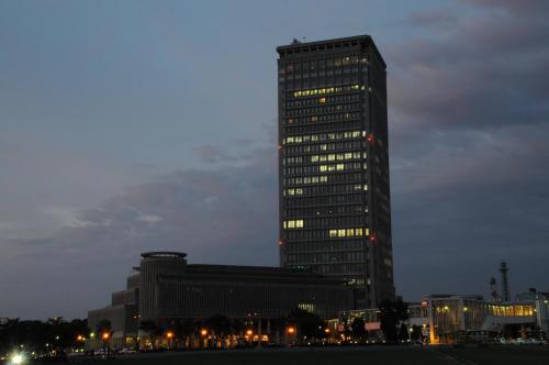a tall building with lights in front of it at Yamagata Eki Nishiguchi Washington Hotel in Yamagata