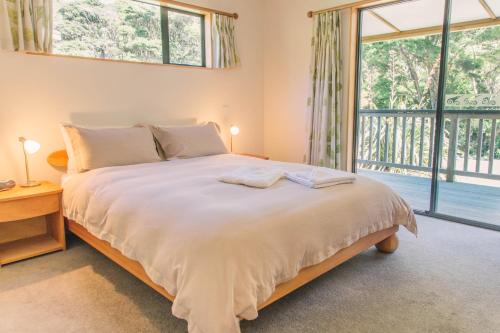 Ліжко або ліжка в номері Tangiaro Retreat