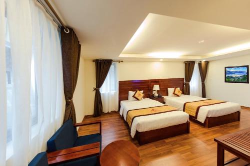 Giường trong phòng chung tại Sapa Lodge Hotel