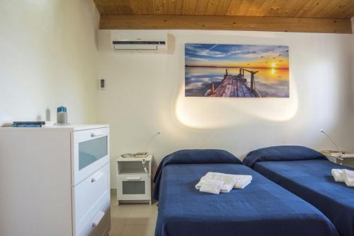 Postel nebo postele na pokoji v ubytování Fèdeli House Sea