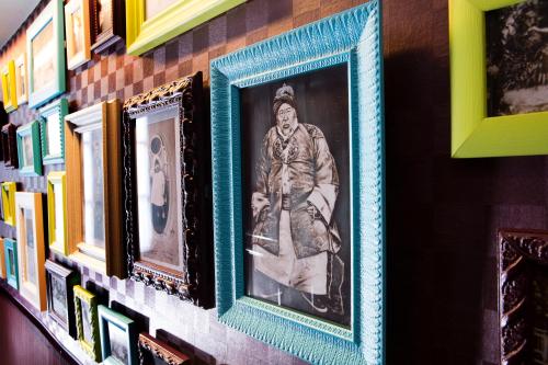 a framed picture of a man hanging on a wall at Hotel Design Sorbonne in Paris
