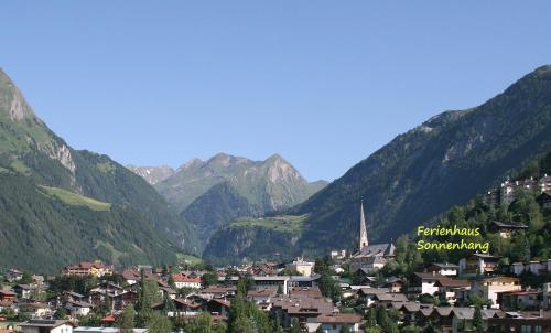 a town in a valley with mountains in the background at Ferienhaus Sonnenhang in Matrei in Osttirol