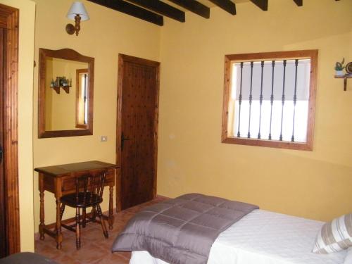 Casa Rural San José tesisinde bir odada yatak veya yataklar
