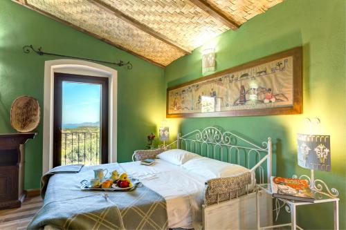 En eller flere senge i et værelse på Hotel Villa Gli Asfodeli