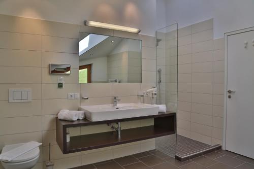 a bathroom with a sink and a mirror at Lunaris Apart in Sölden