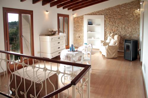 a living room with a staircase leading to a living room at Casa Bella Mirada in Caimari