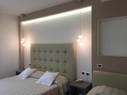 Postel nebo postele na pokoji v ubytování Villa Accini